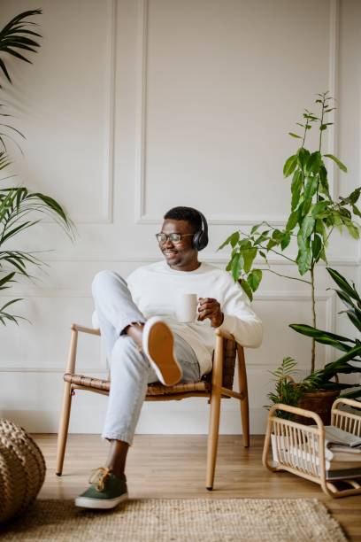 Young man listens to music while scrolls social media