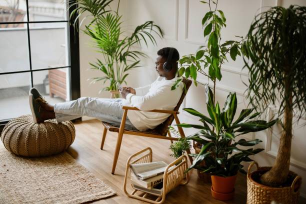 istock Young man listens to music while scrolls social media 1318116546