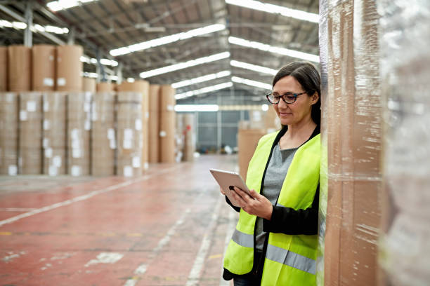 istock Mature Female Warehouse Foreperson Using Digital Tablet 1318116735