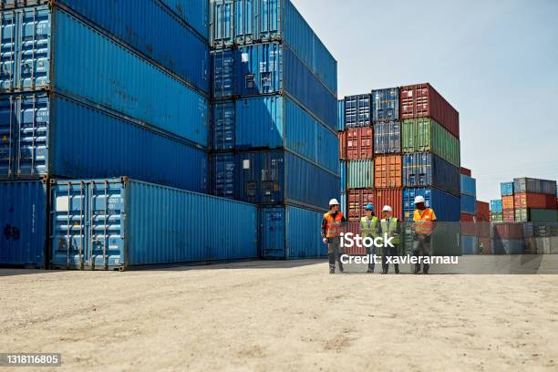 Logistics Team Walking Together In Inland Port Stock Photo - Download Image Now - Freight Transportation, Supply Chain, Delivering