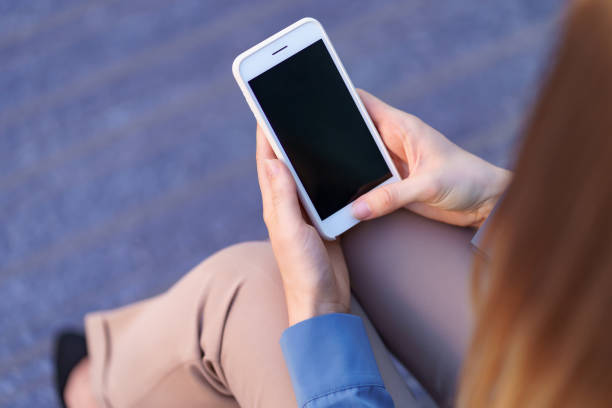 istock Woman hands holding smartphone 1318119732