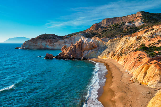 Agios Ioannis greek beach and Aegean sea on sunset. Milos island, Greece