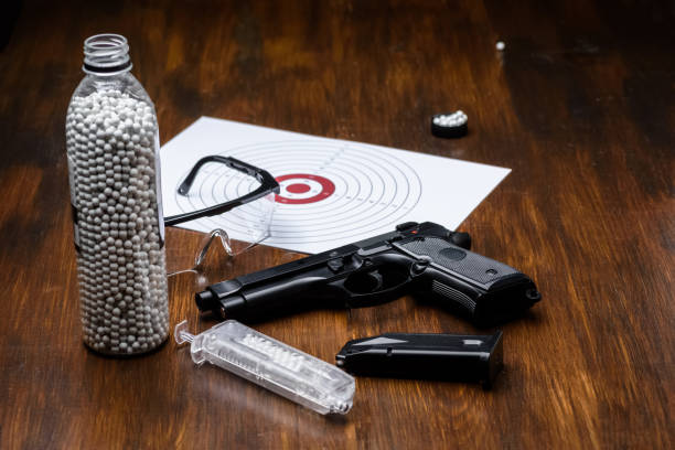 istock pistol replica, shield, glasses, speedloader and plastic balls 1318121265
