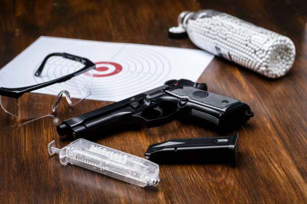 istock pistol replica, shield, glasses, speedloader and plastic balls 1318121327