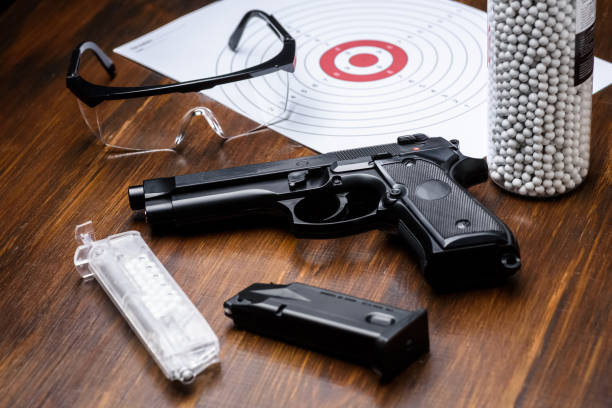 istock pistol replica, shield, glasses, speedloader and plastic balls 1318121337