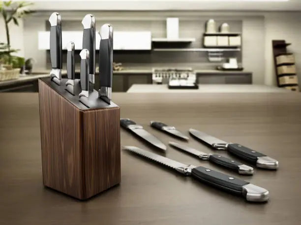 Set of kitchen knives standing on the table.