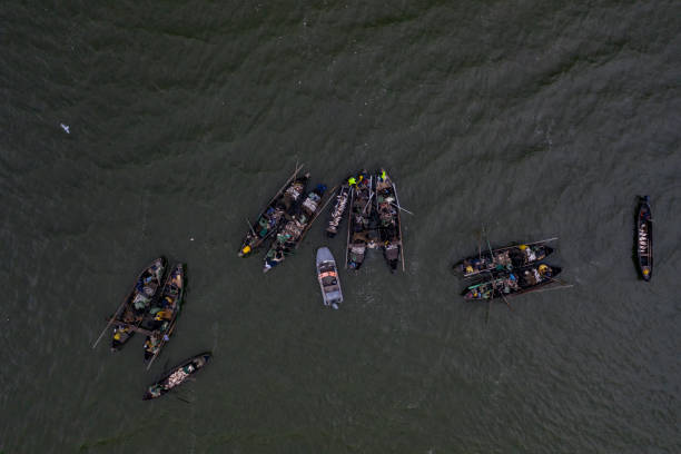 istock Fishing boats, floating the calm waters 1318126395