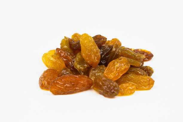 istock golden raisins on white background. food, fruit, grape. 1318128713