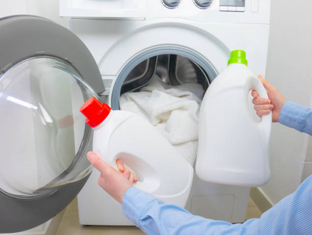 istock Choose laundry detergent. Compare two bottles of liquid detergent for the washing machine. 1318135155