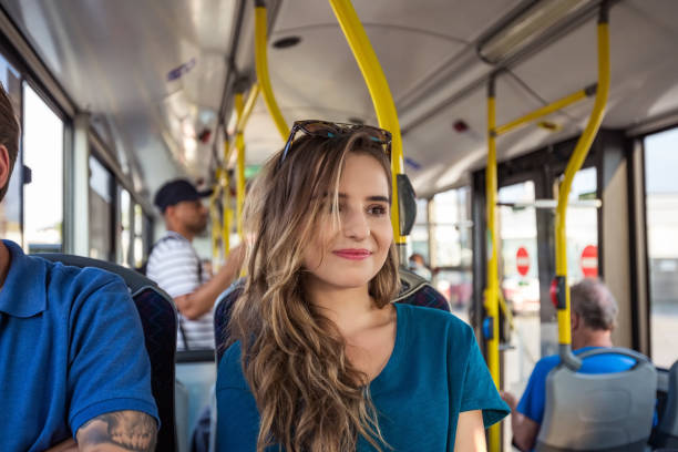istock Young female looking away while traveling in bus 1318136276