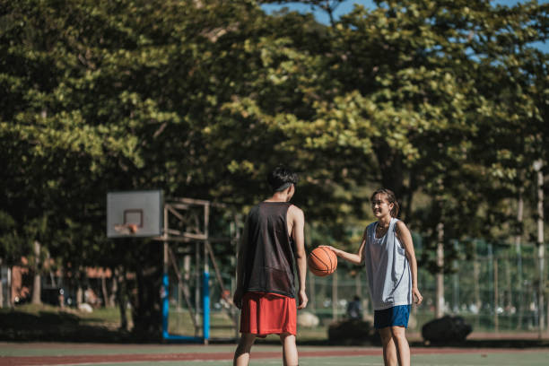 istock An Asian couple playing basketball 1318136297