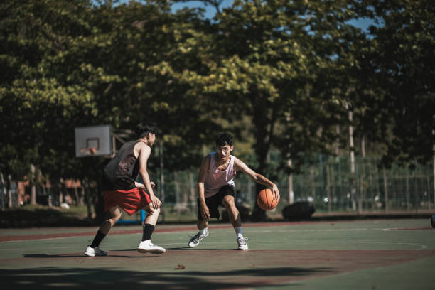 istock Playing basketball with friends 1318136316