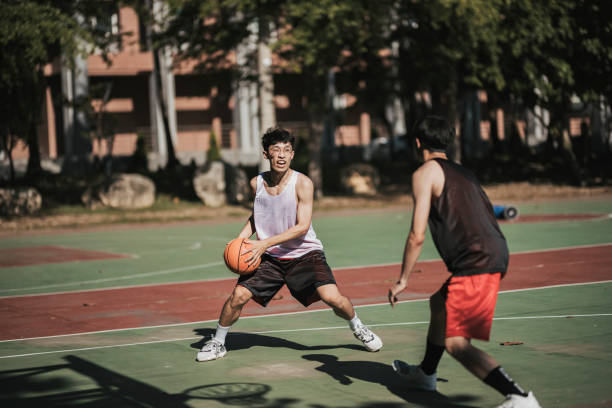 istock Playing basketball with friends 1318136334