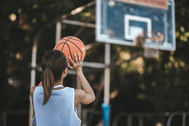 istock Asian women playing basketball 1318136350