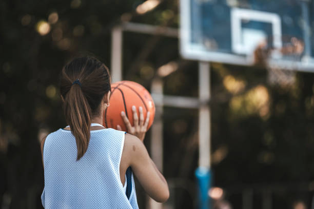 istock Asian women playing basketball 1318136369
