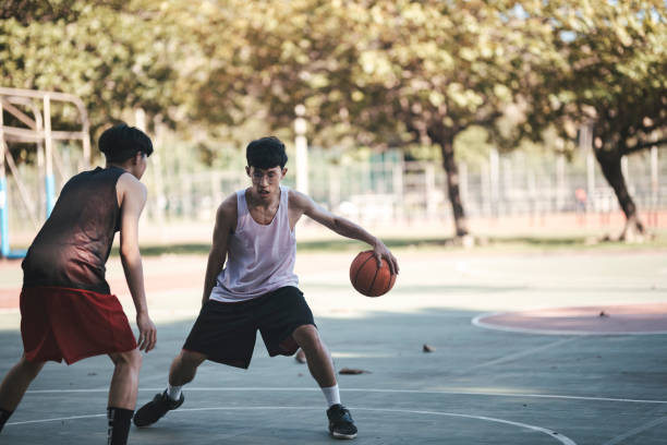 istock Playing basketball with friends 1318136427