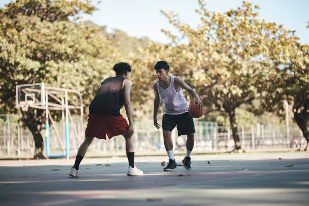 istock Playing basketball with friends 1318136443