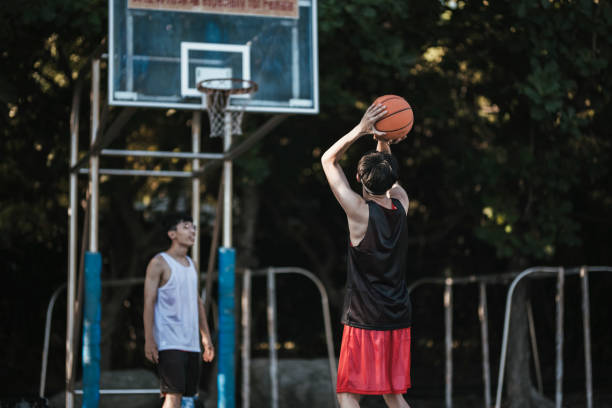 istock Playing basketball with friends 1318136991