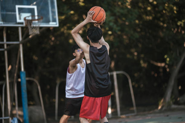 istock Playing basketball with friends 1318137124