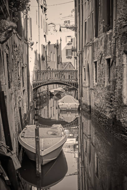 istock Canal in Venice with bridge and boats 1318137225