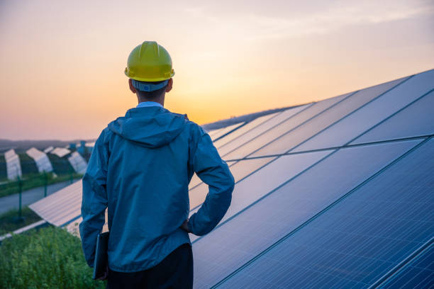 istock Engineer standing in solar power station planning new project 1318137350