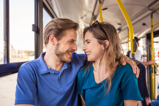 istock Happy young couple traveling in bus 1318137743