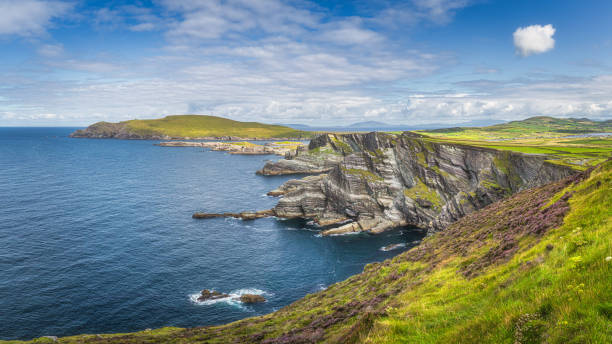 Large panorama with Kerry Cliffs and blue coloured Atlantic Ocean, Ireland Large panorama with Kerry Cliffs and blue coloured Atlantic Ocean on a sunny summer day, Portmagee, Iveragh peninsula, Ring of Kerry, Ireland republic of ireland stock pictures, royalty-free photos & images