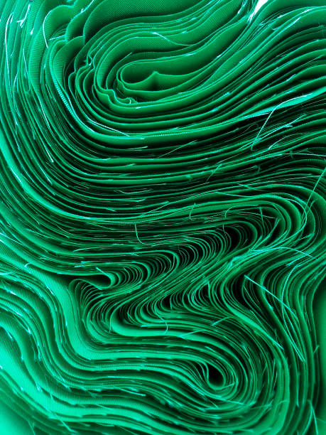 a roll of green cotton cloth