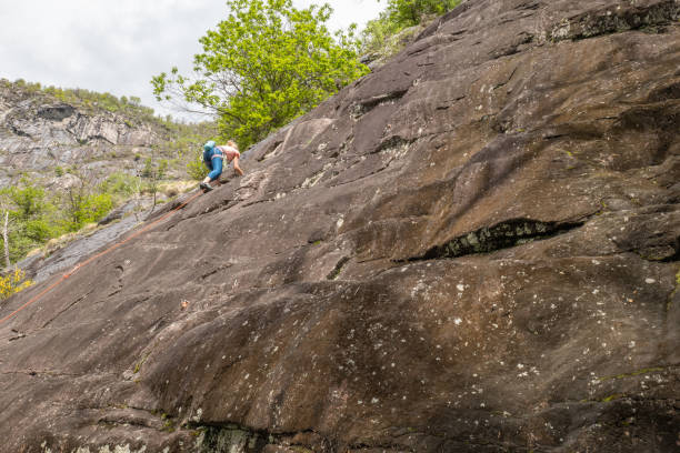 istock Sporty woman leading a climb 1318141175