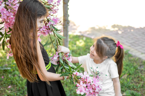 istock Beautiful sisters having fun outdoors 1318142912