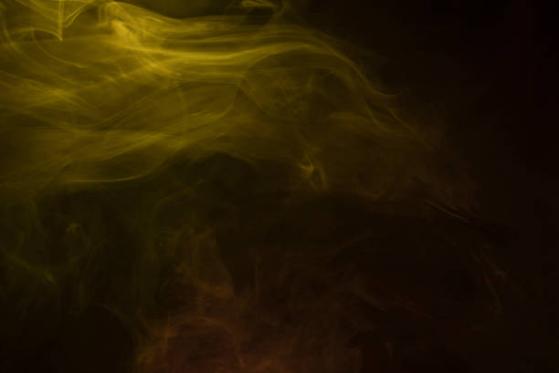 istock Yellow and pink steam on a black background. 1318142966