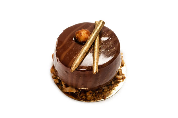 istock Chocolate and caramel cake isolated on a white background. 1318143001