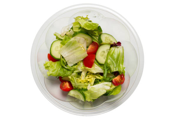 istock Salad with fresh vegetables isolated on a white background. 1318143024