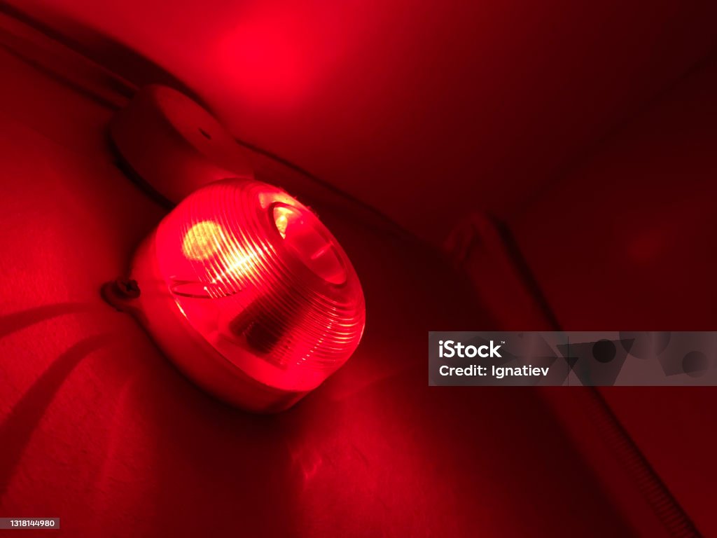 The emergency alert system is always ready for operation. The emergency alert system is always ready for operation. In the event of an emergency, the sound and visual security system will work. The red light will turn on. Danger Stock Photo