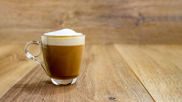 cappuccino in glass cup on wooden table, panorama - cafe macchiato latté heat coffee imagens e fotografias de stock