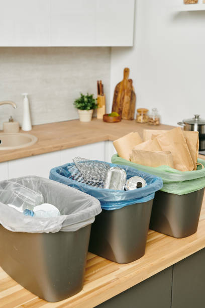 istock Group of plastic buckets with various waste in them 1318146193
