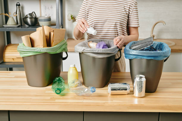 istock A person putting small plastic yoghurt bottle into trash bin 1318146195