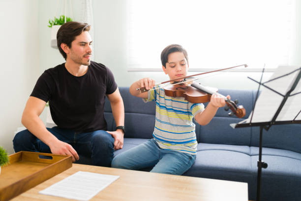 istock Music instructor feeling proud of his student 1318148650