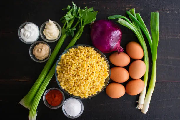 Macaroni, eggs, mayonnaise, and other raw ingredients