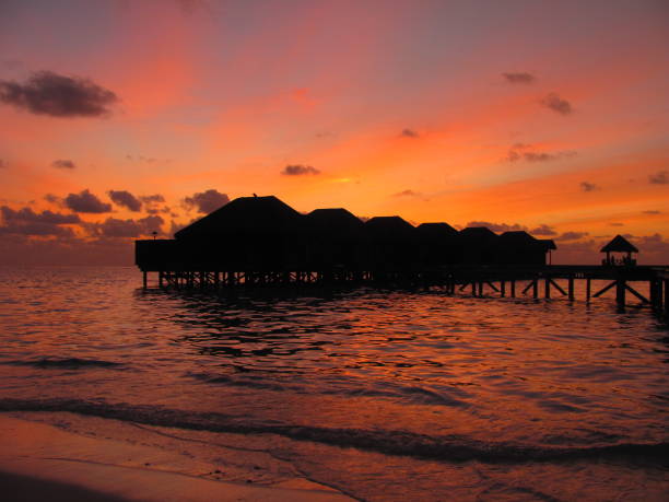 istock Beautiful sunset in a Maldives island resort 1318149628