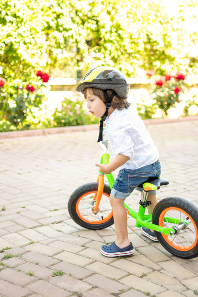 istock Cute boy riding bike 1318149657