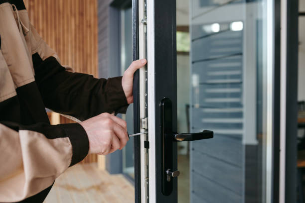 istock A man fixing detail in the door while doing his work 1318150125