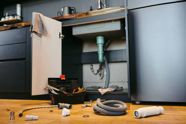 istock Open door of cabinet under sink in the kitchen 1318150309