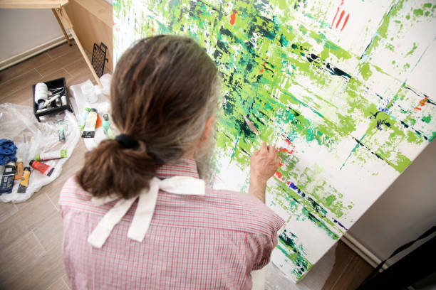 istock Senior male artist in his studio 1318150932