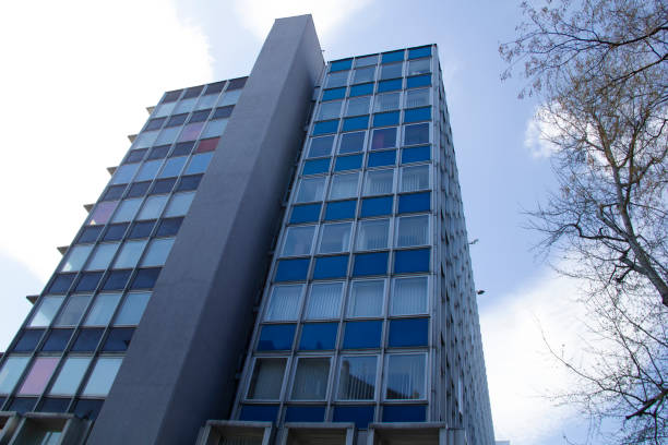 istock Office Building Reflecting with Blue Sky in the Business District 1318153598
