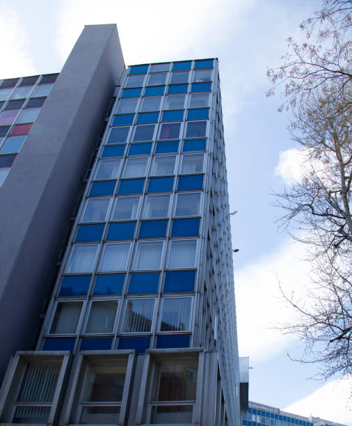 istock Office Building Reflecting with Blue Sky in the Business District 1318153641