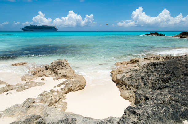 istock Half Moon Cay Rocky Beach And A Cruise Ship 1318153799