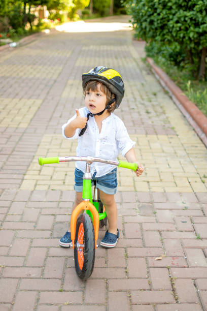 istock Cute boy riding bike 1318154996