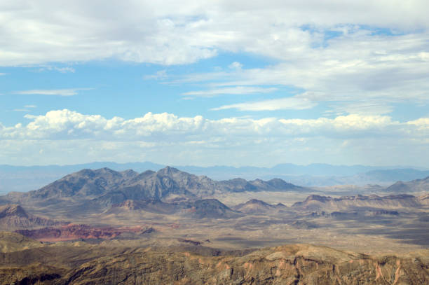 Elevated viewpoint Images of rocky and desert landscape under blue skies with broken cloud