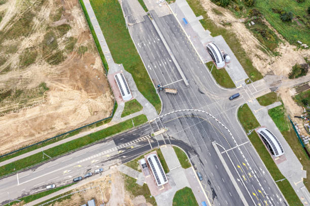 istock suburb crossroad under construction. road construction site. aerial view 1318157820